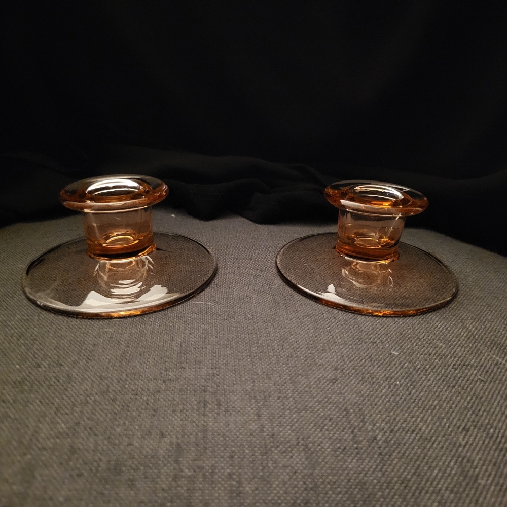 Pink depression glass candle holders. Has mild glow under 365 l8ght